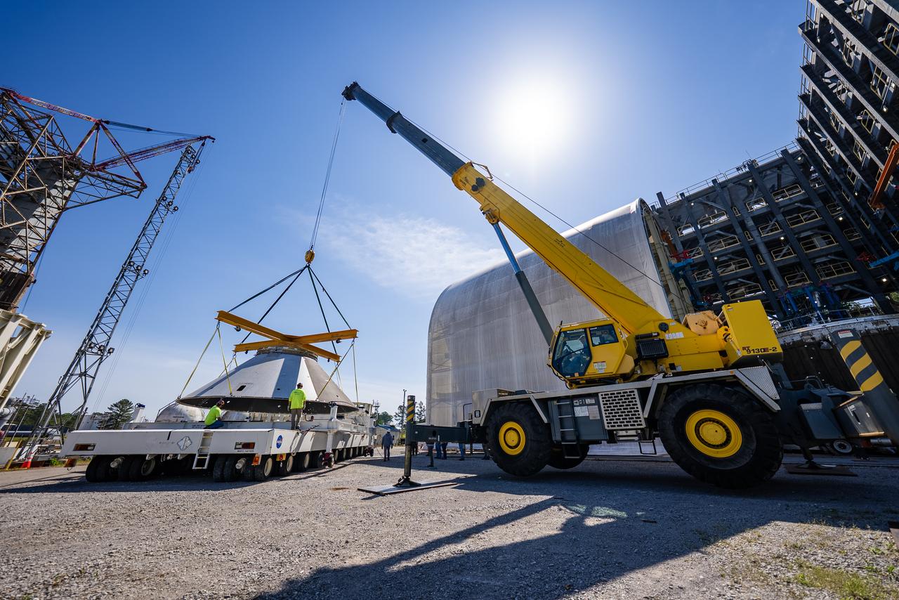 Technicians at NASA’s Marshall Space Flight Center in Huntsville, Alabama, are seen in these images taken April 17, 2025, moving the payload adapter test article from Building 4697 to Building 4705 for storage. This move marks the end of structural testing for the test article. Next, engineers will complete the qualification article and conduct additional for further testing before building the final flight hardware. Manufactured at Marshall, the test article underwent extensive and rigorous testing to validate the design before engineers finalized the configuration for the flight article. The newly completed composite payload adapter is an evolution from the Orion stage adapter to be used in the upgraded Block 1B configuration of the SLS (Space Launch System) rocket, debuting with Artemis IV.